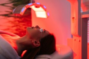 female patient undergoes red LED light or RLT therapy for skin rejuvenation